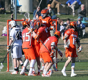 Syracuse celebrates one of its 12 goals against Virginia. The SU offense found success by slowing things down on Sunday.