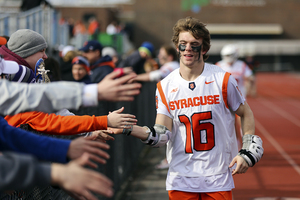 Brendan Curry offers high-fives after SU's win over Duke.
