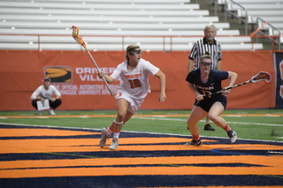 Nicole Levy drives the ball toward cage from the X. 